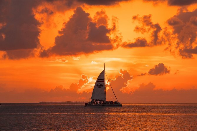Key West Rum and Reggae: Reef Snorkel Adventure and Sunset Sail - Returning aboard for rum punch and reggae